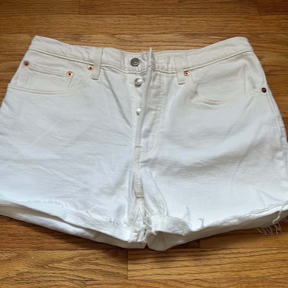 Levi’s button fly distressed white shorts